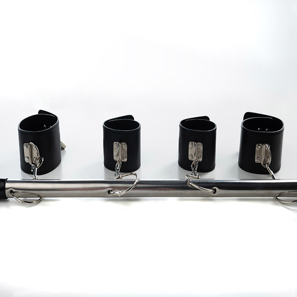 Spreader bar with wrist and ankle cuffs